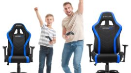 Portrait of father and son playing video game on white backgroun